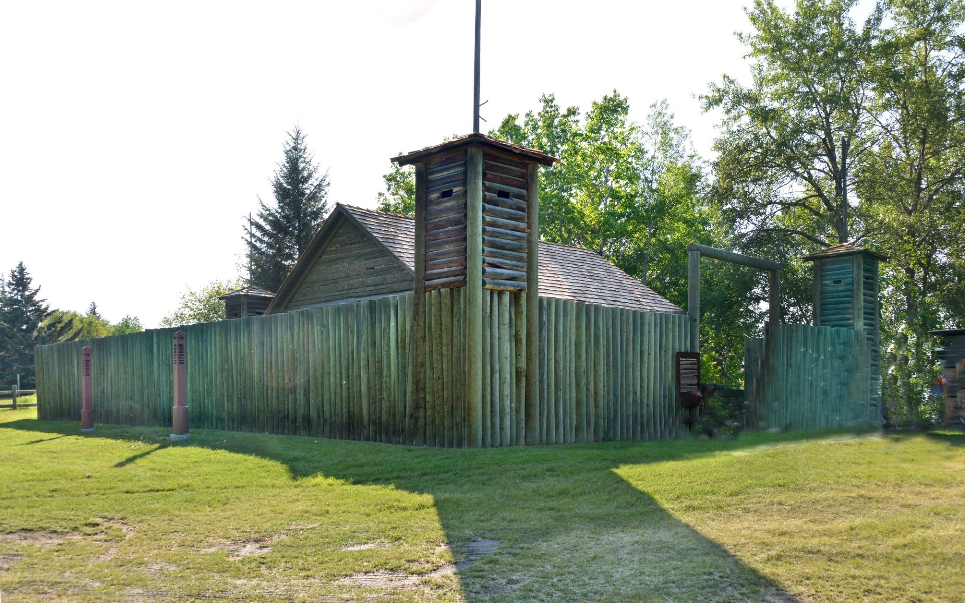 A wooden palisade surrounds the reconstructed Fort.