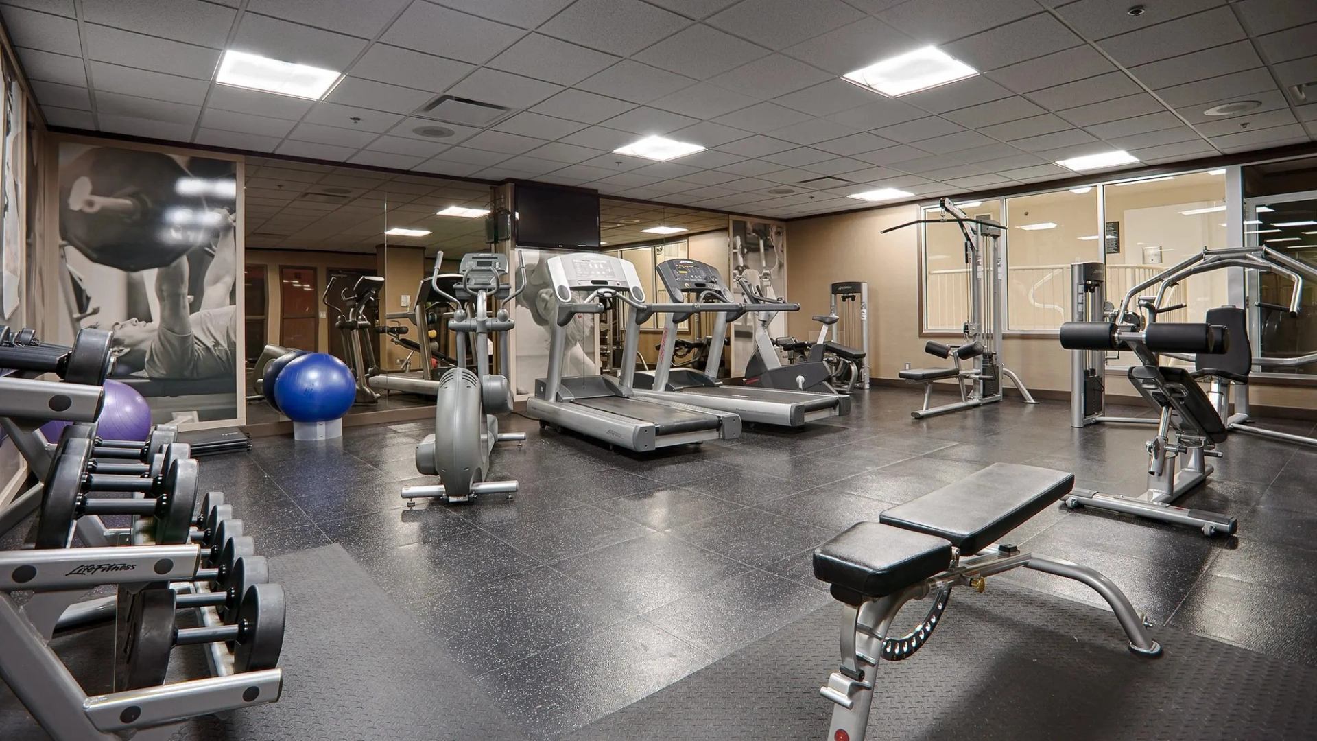 Fitness room with workout equipment.