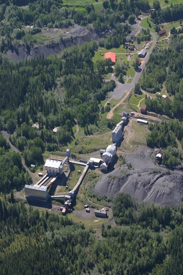 Aerial view of Brazeau Collieries mine site with buildings and greenery.