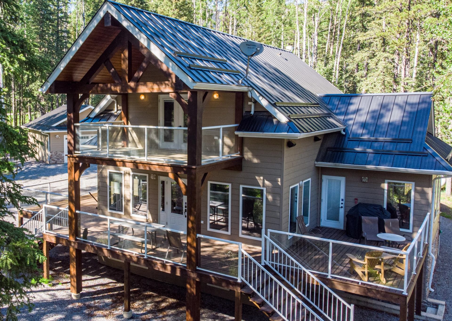 Modern cabin with deck in peaceful forest.