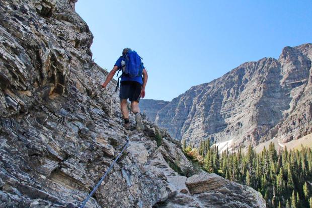 Backpackers hiking the Crypt Lake Trail.