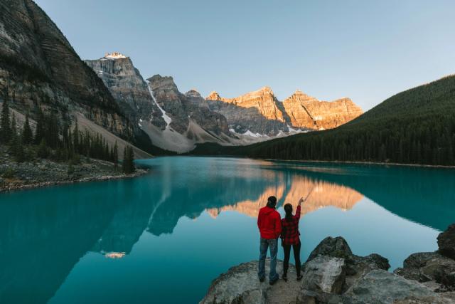 Couple enjoying the view of Moraine Lake.