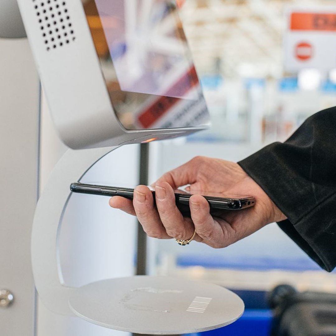 A person scanning their flight pass.