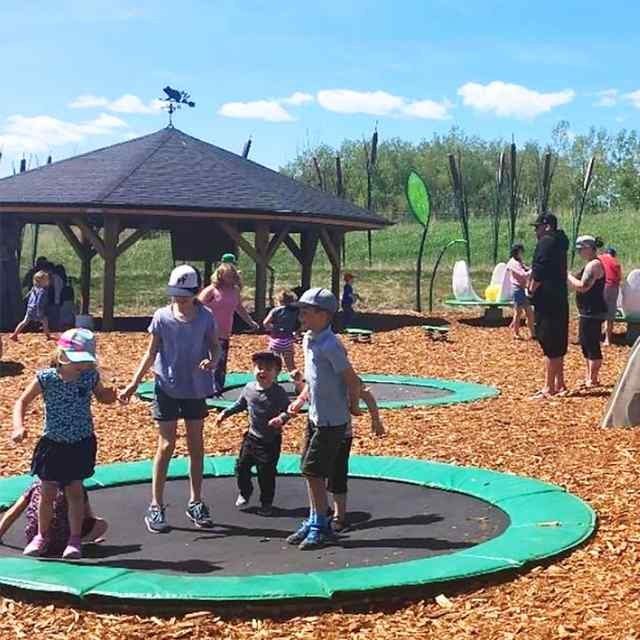 Kids jumping on trampolines.