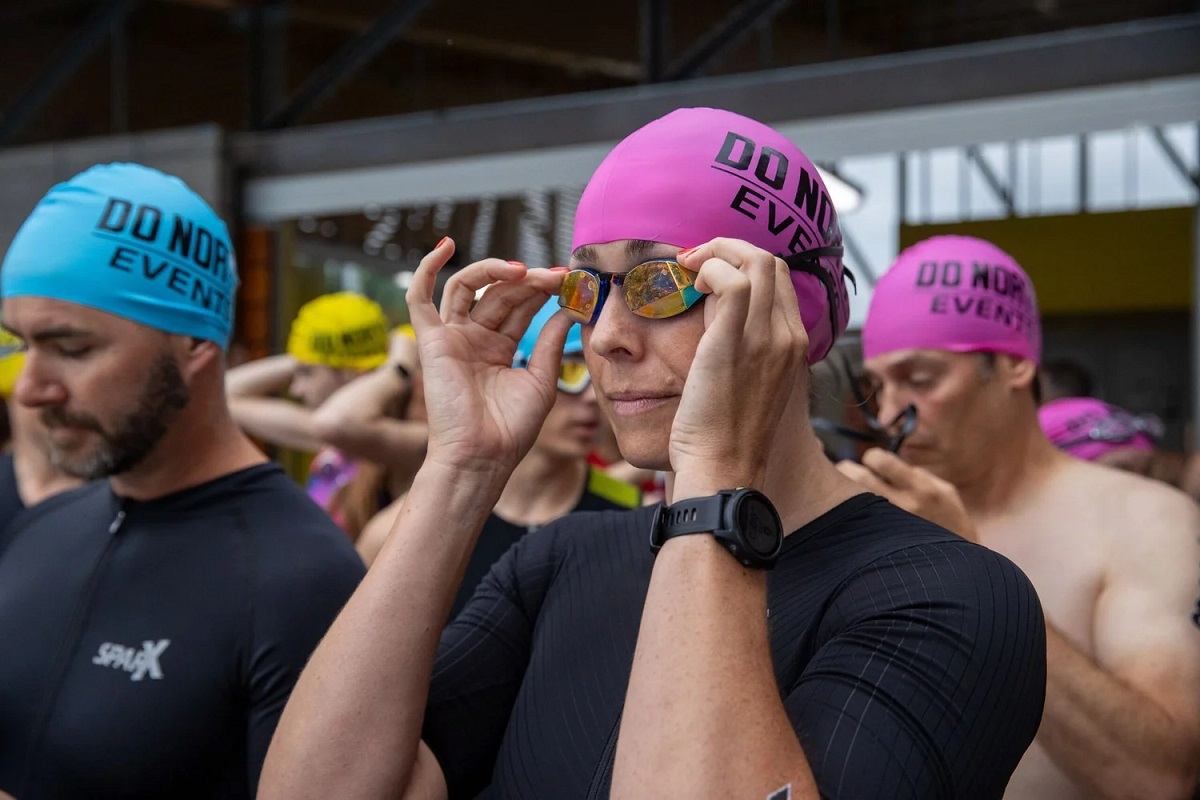Athletes in swim caps ready to race at Do North Tri & Trail.
