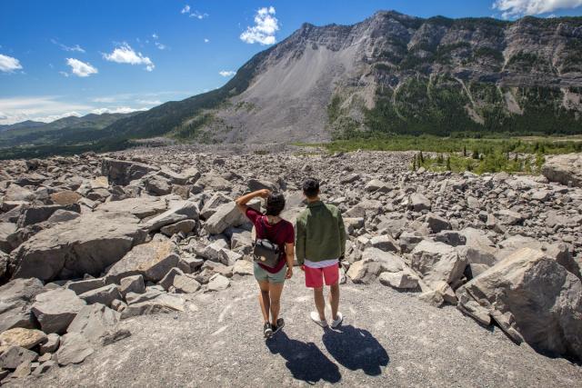 Two guests on an trail at Frank Slide in the Crowsnest Pass.