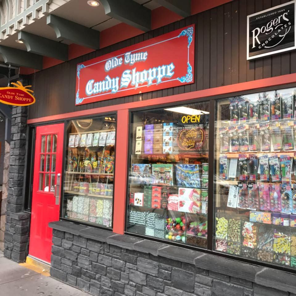 Exterior of the store with a bright red door at the entrance.