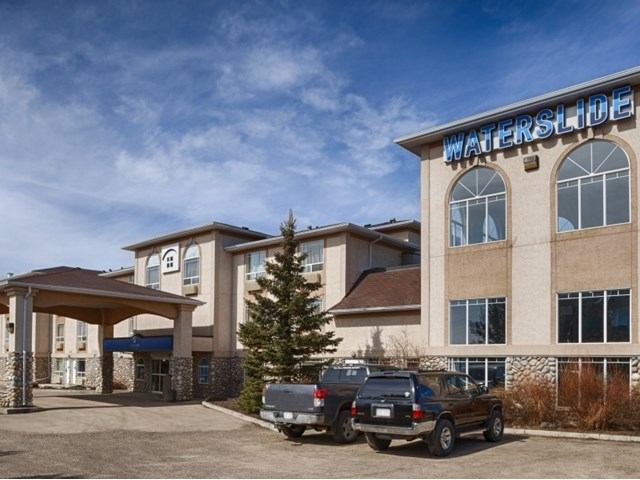 Exterior of Canalta Hotel with entrance canopy and “Waterslide” sign.