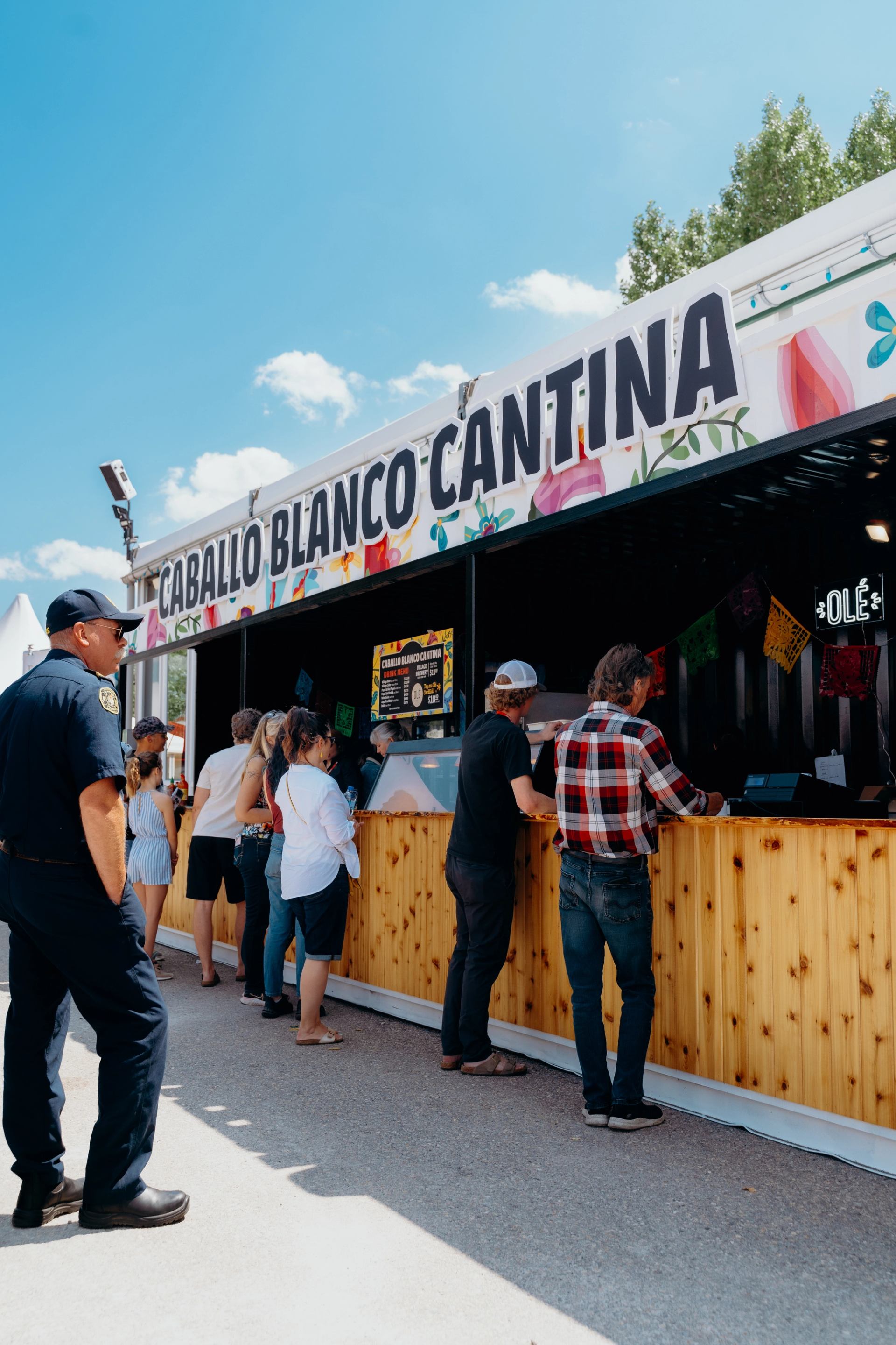 Guests line up at the Caballo Blanco Cantina food stand during the tournament.