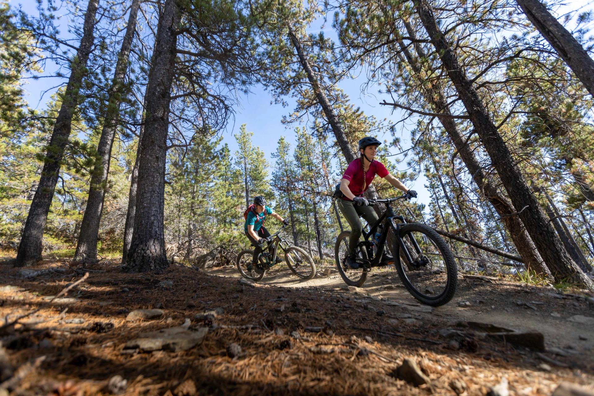 Couple biking the trails of Bragg Creek.