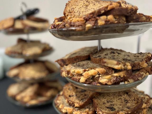 Tray towers with slices of baked goods.