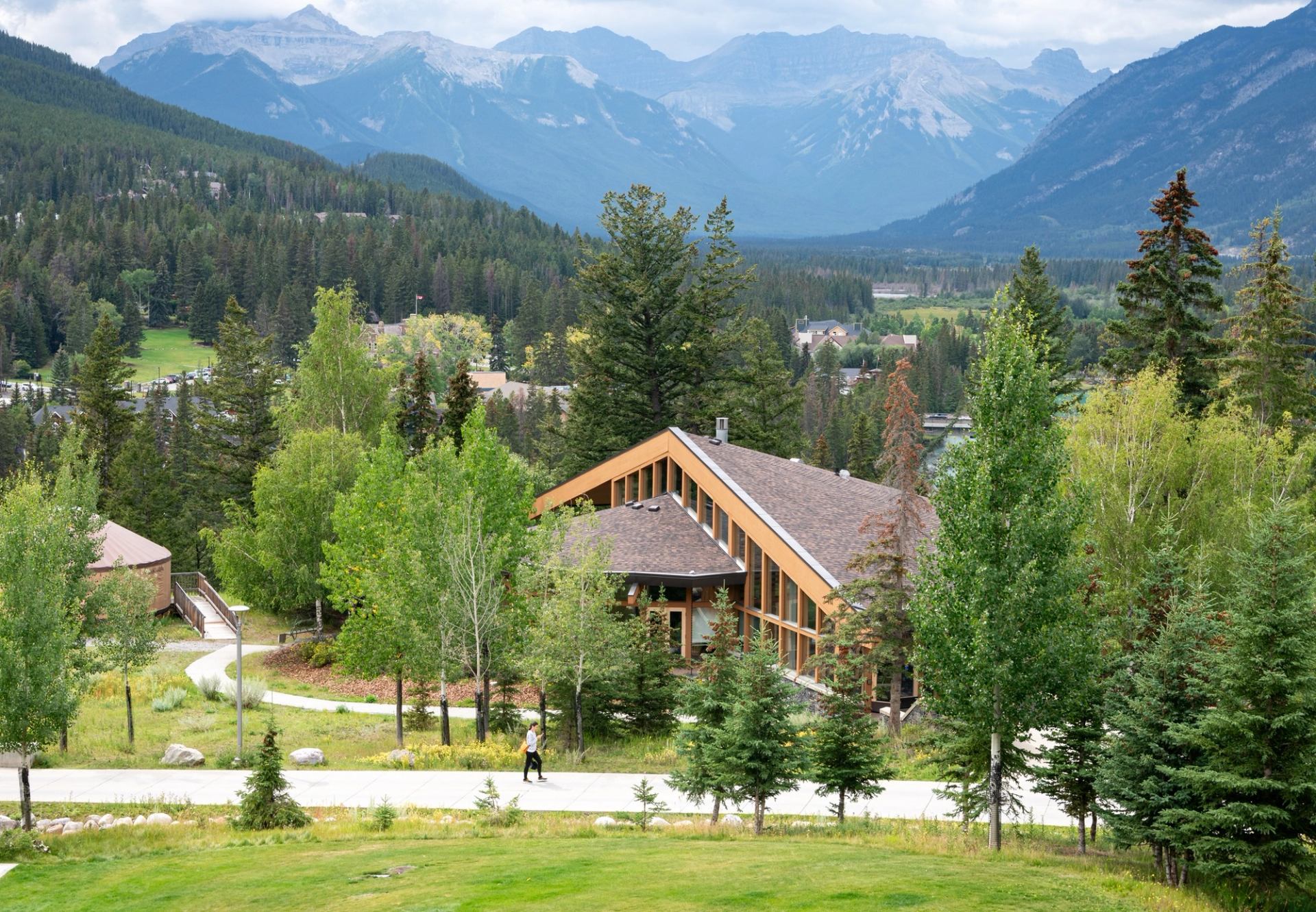 Banff Centre for Arts and Creativity surrounded by trees and green grass.