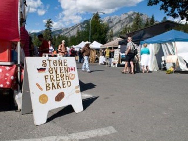 Street view of tent stalls at the Banff Farmer's Market.