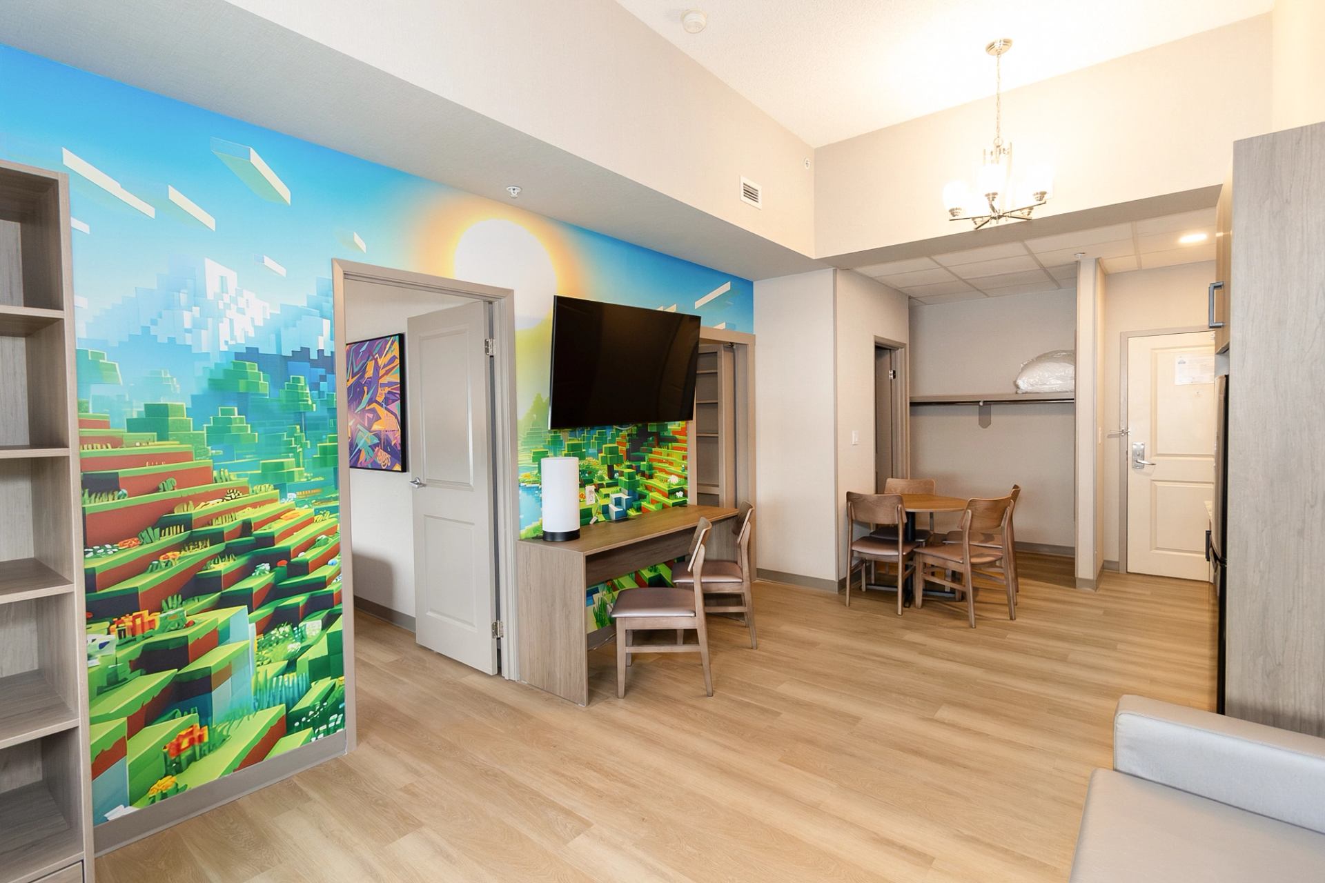 main living area of the kids theme room, main wall features mine craft scenery.