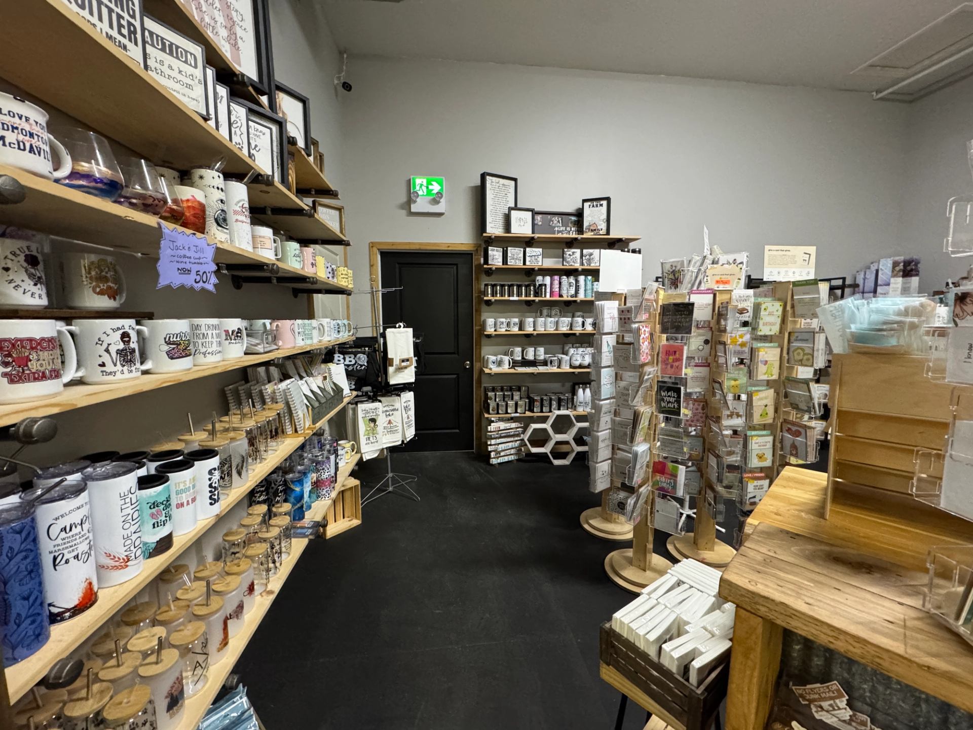 Interior of Farmstead Market & More with shelves of mugs, books, cards, and gift items.