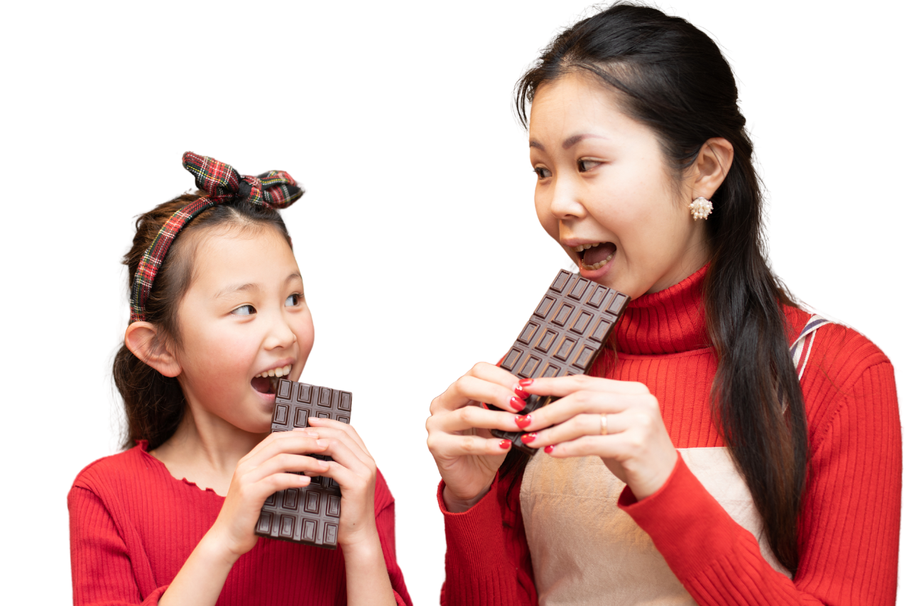 Mother and child enjoying chocolate samples at ChocoFest at Sherwood Park, Alberta. April 25 & 26, 2025