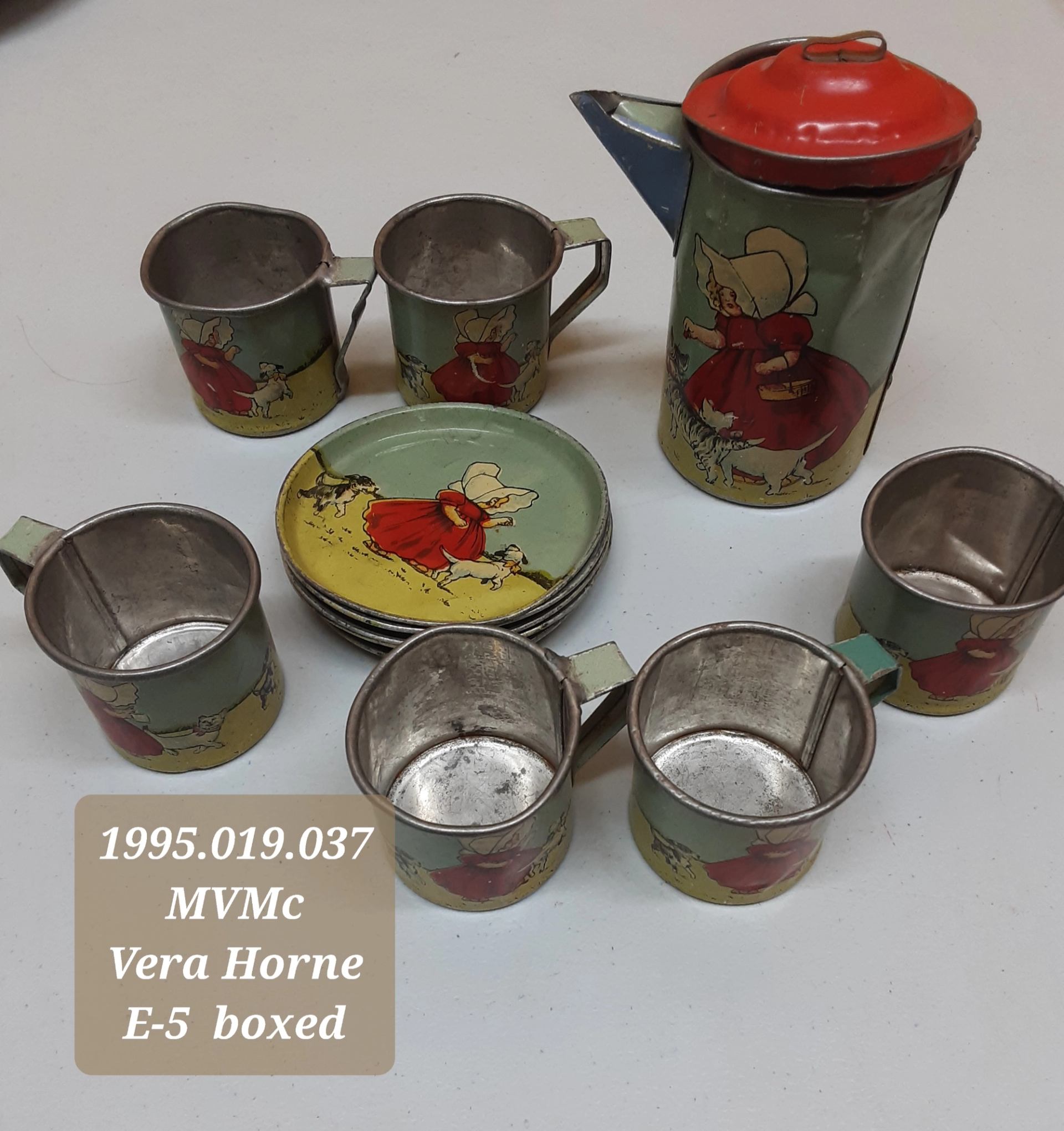 This photo shows a set of toy dishes from the 1930s.