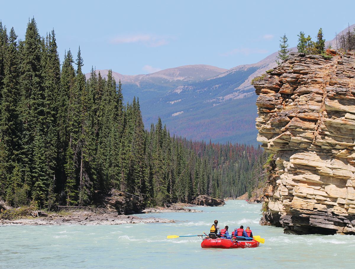 A group of people rafting on the river
