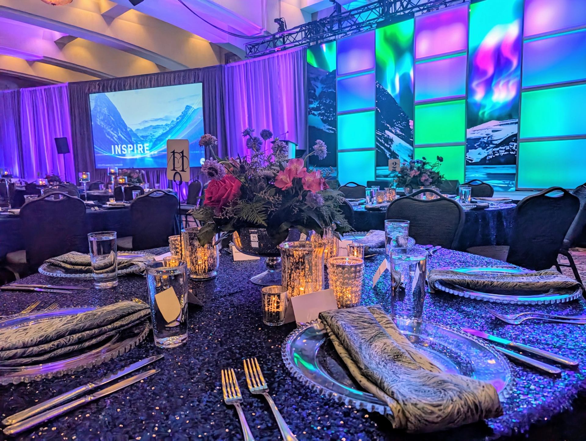 Elegant event setup with vibrant lighting and decor.