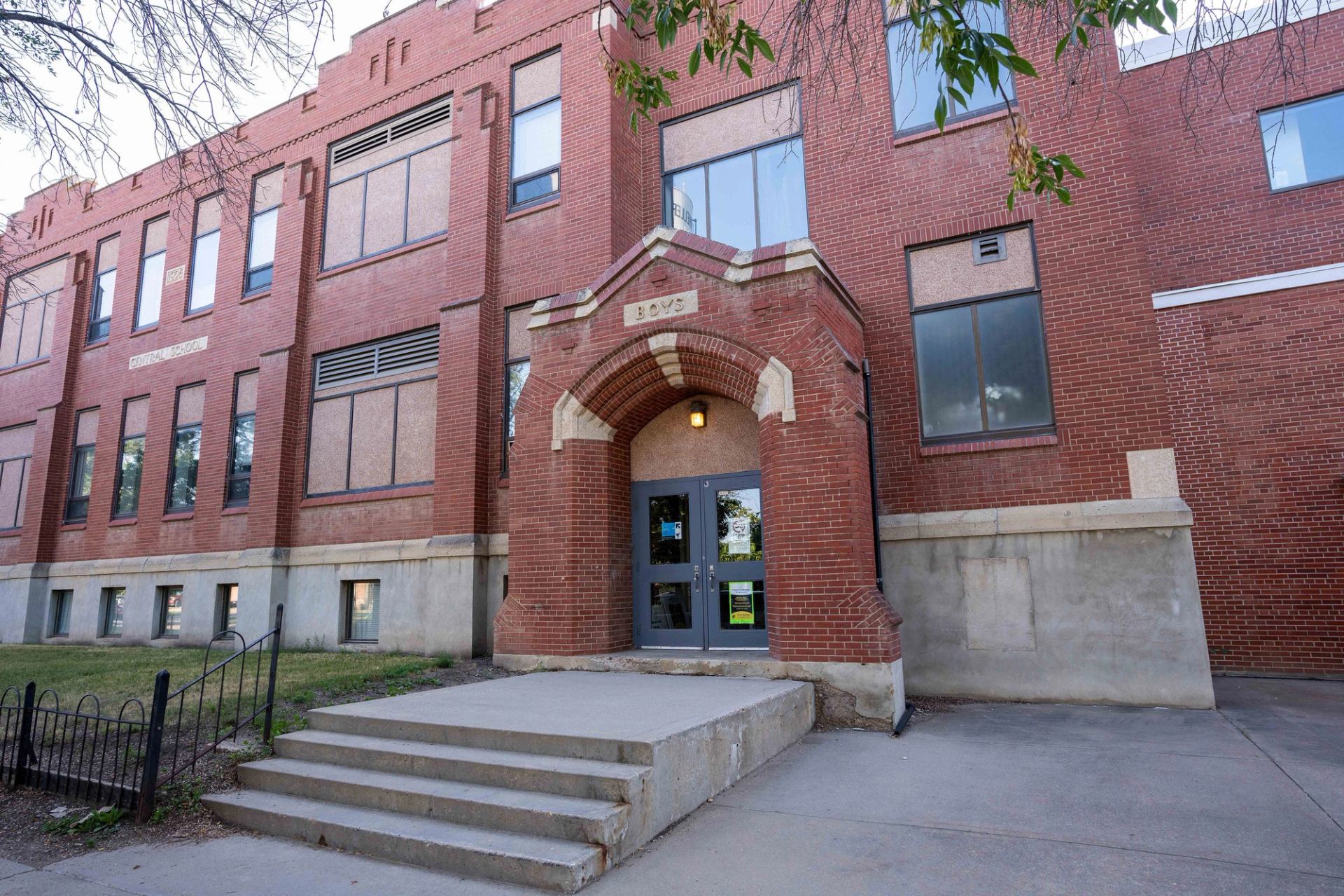 The entrance of large brick building.