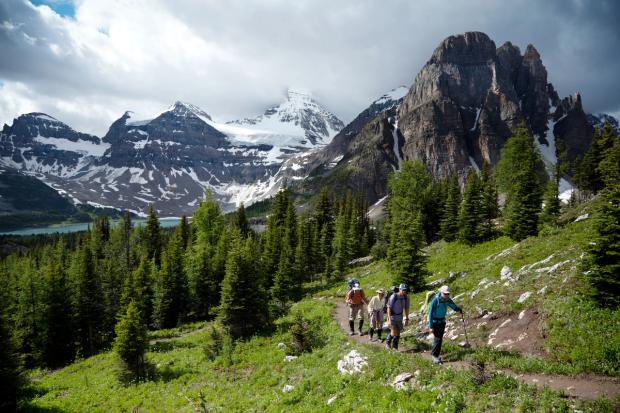 Hiking on the Banff Highline with Lake Magog and Mt Assiniboine in the background.