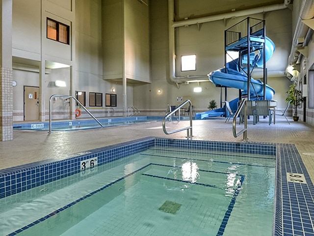 Indoor pool with a spiral slide.