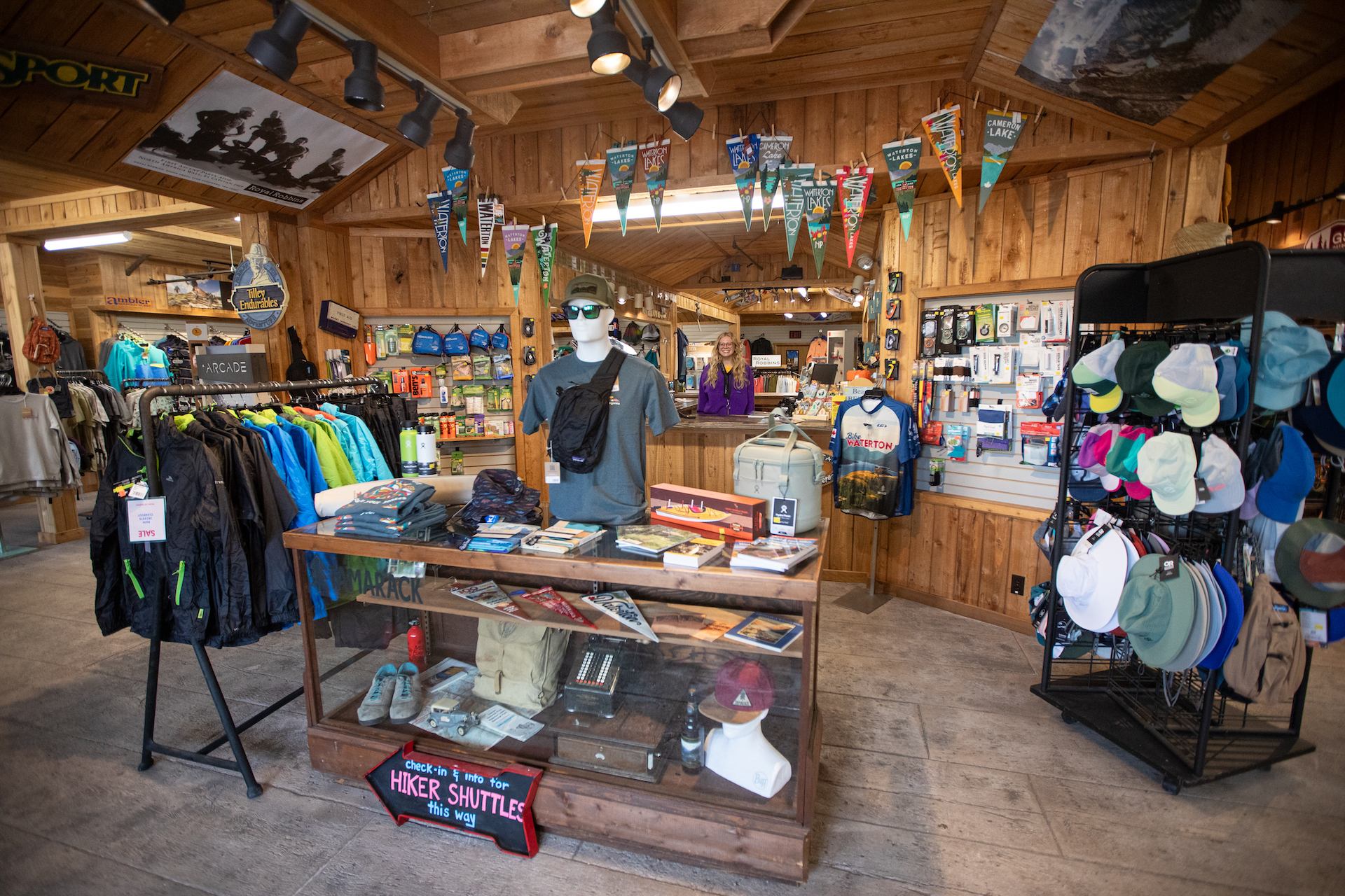 Tamarack gear shop interior with clothing, packs, and adventure accessories.