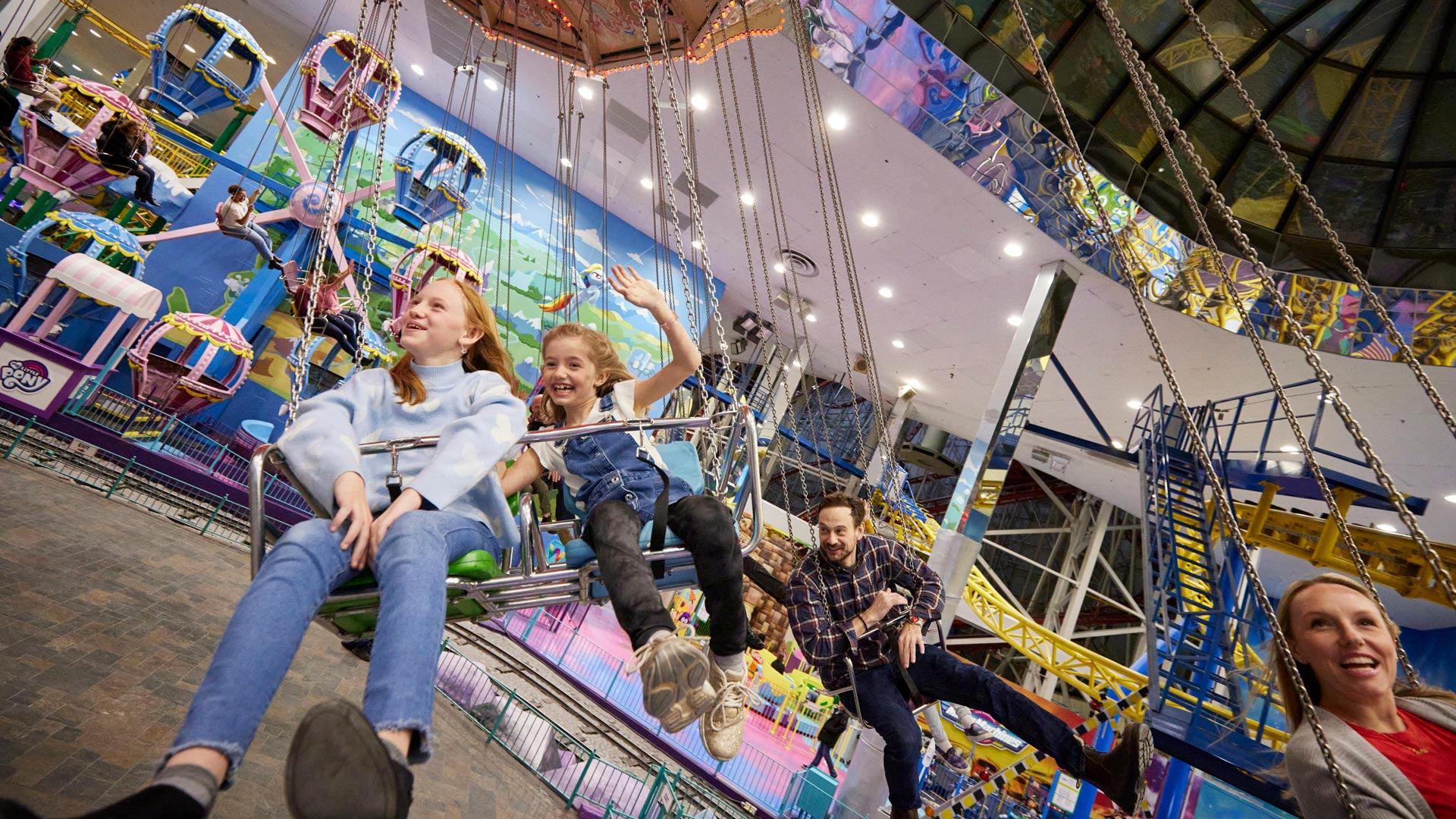 Kids having fun on an amusement ride.