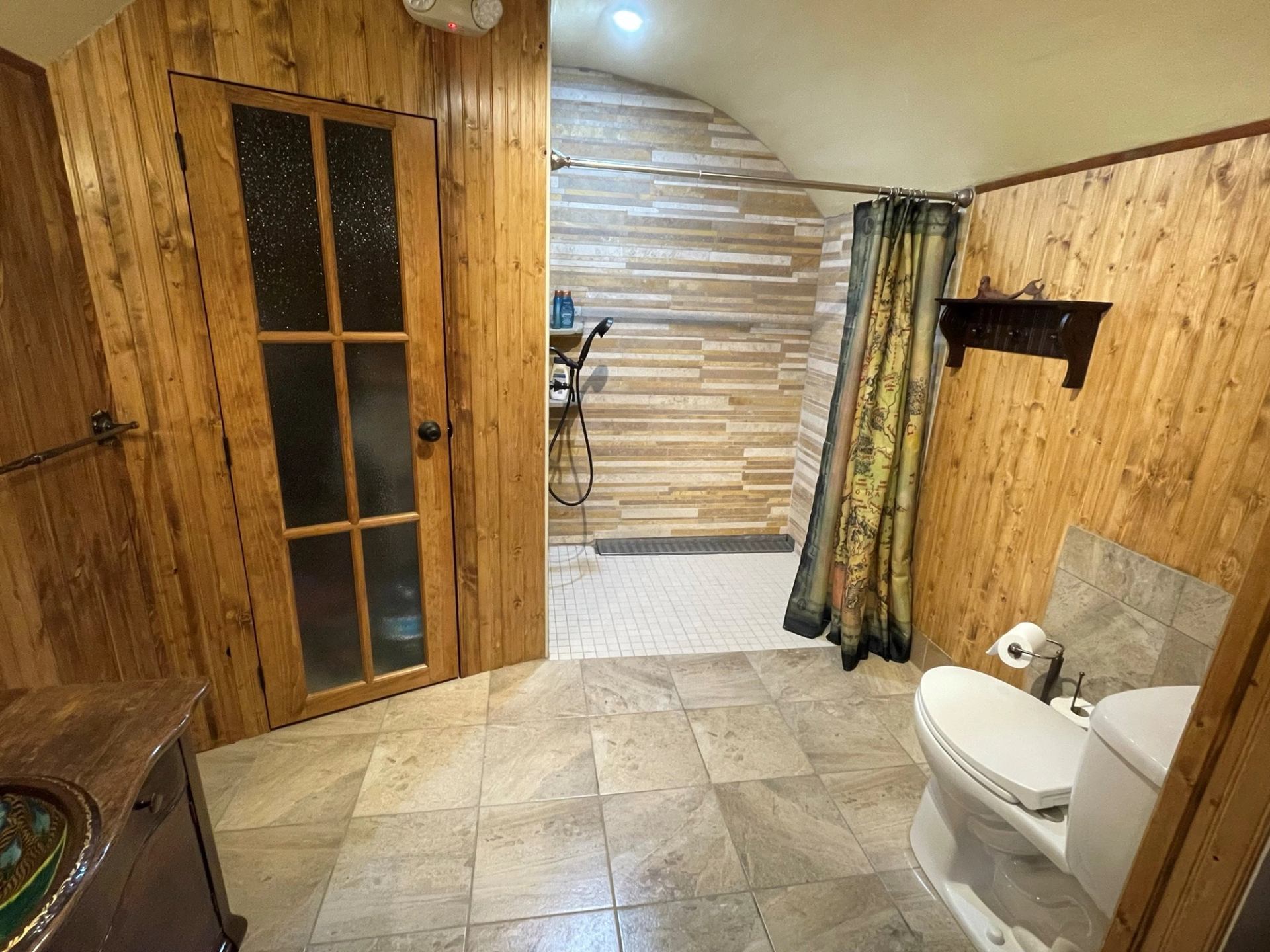 The bathroom with roll in shower at The Burrow at Good Knight.