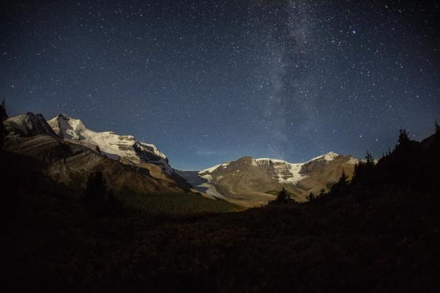 Starry night sky over the Rockies in the Jasper National Park Dark Sky Preserve.