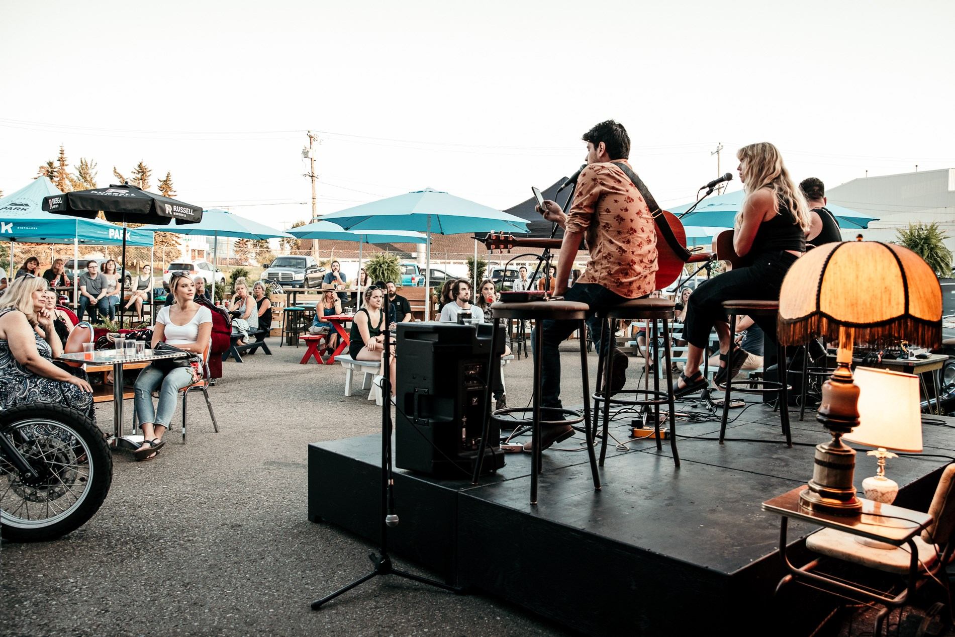 A band on stage with people watching.