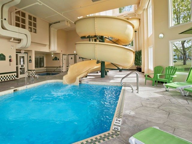 Indoor pool and waterslide at Wingate by Wyndham Calgary.