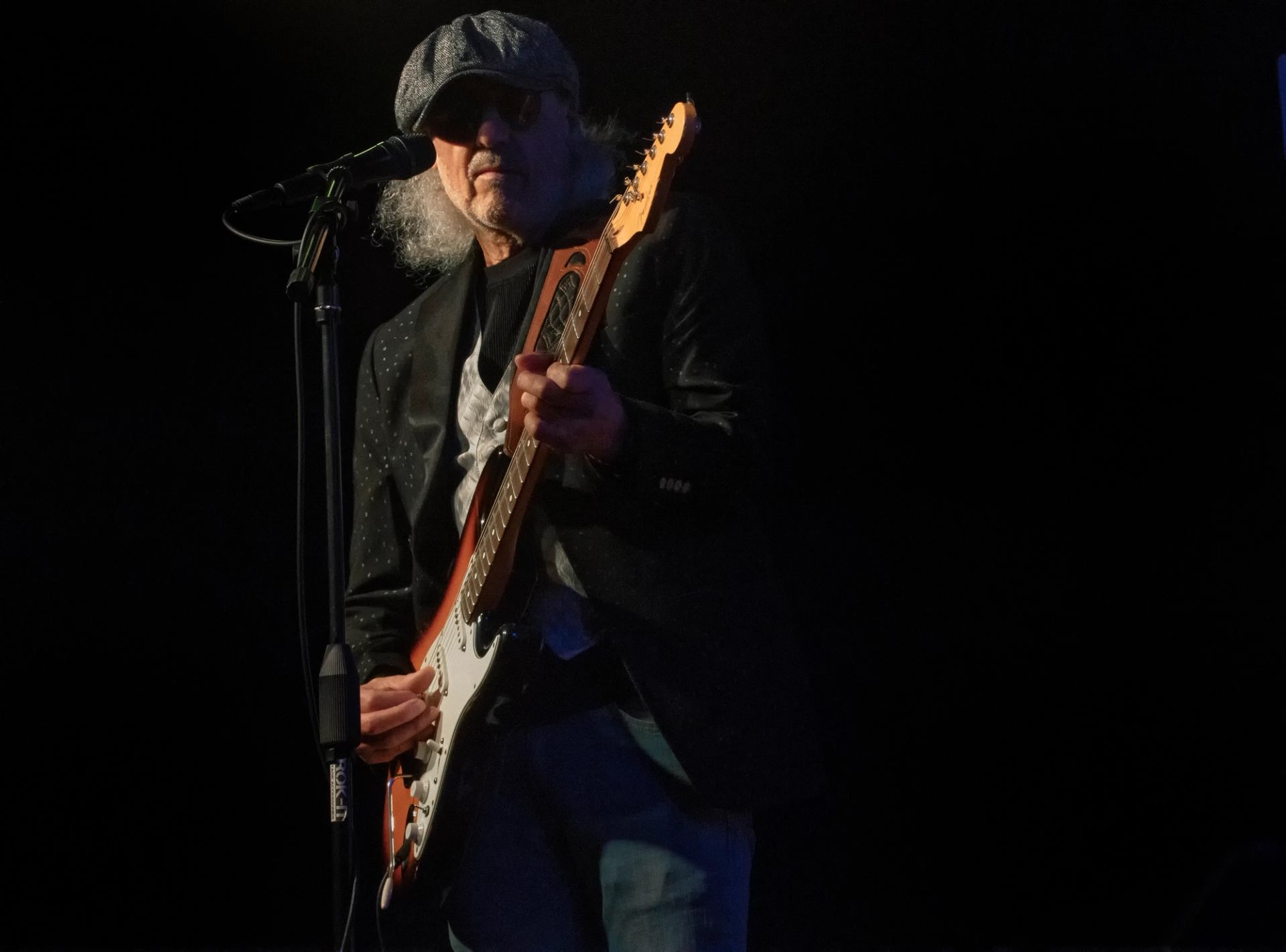 Michael Charles playing his guitar