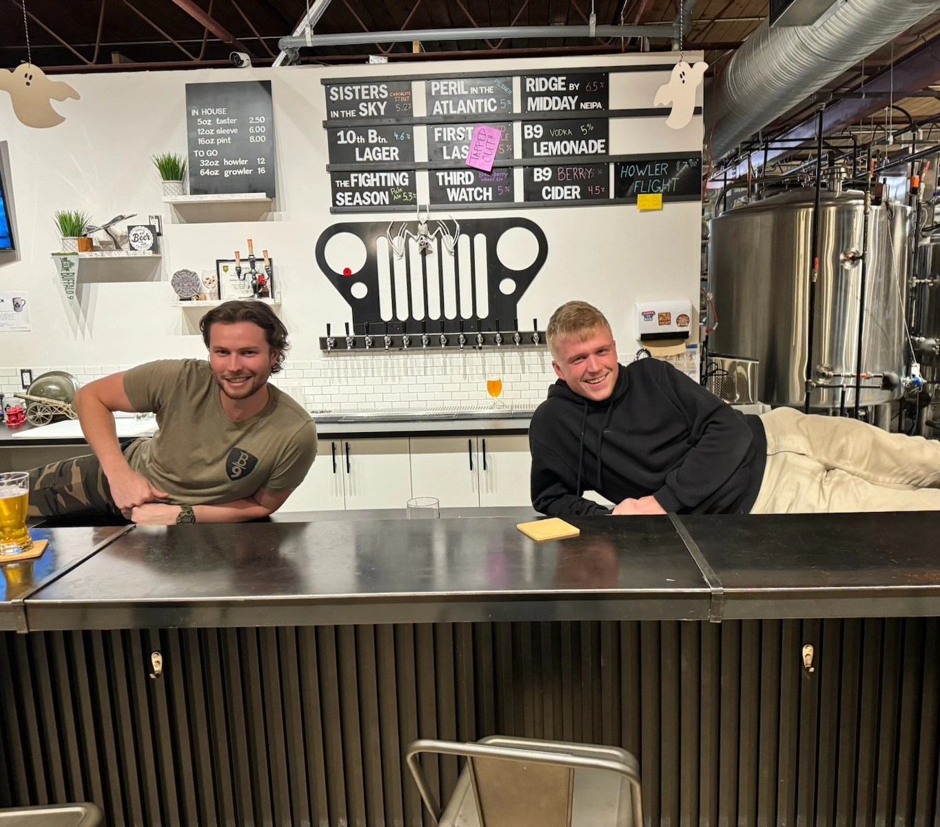 The Taproom staff posing for a picture behind the bar.