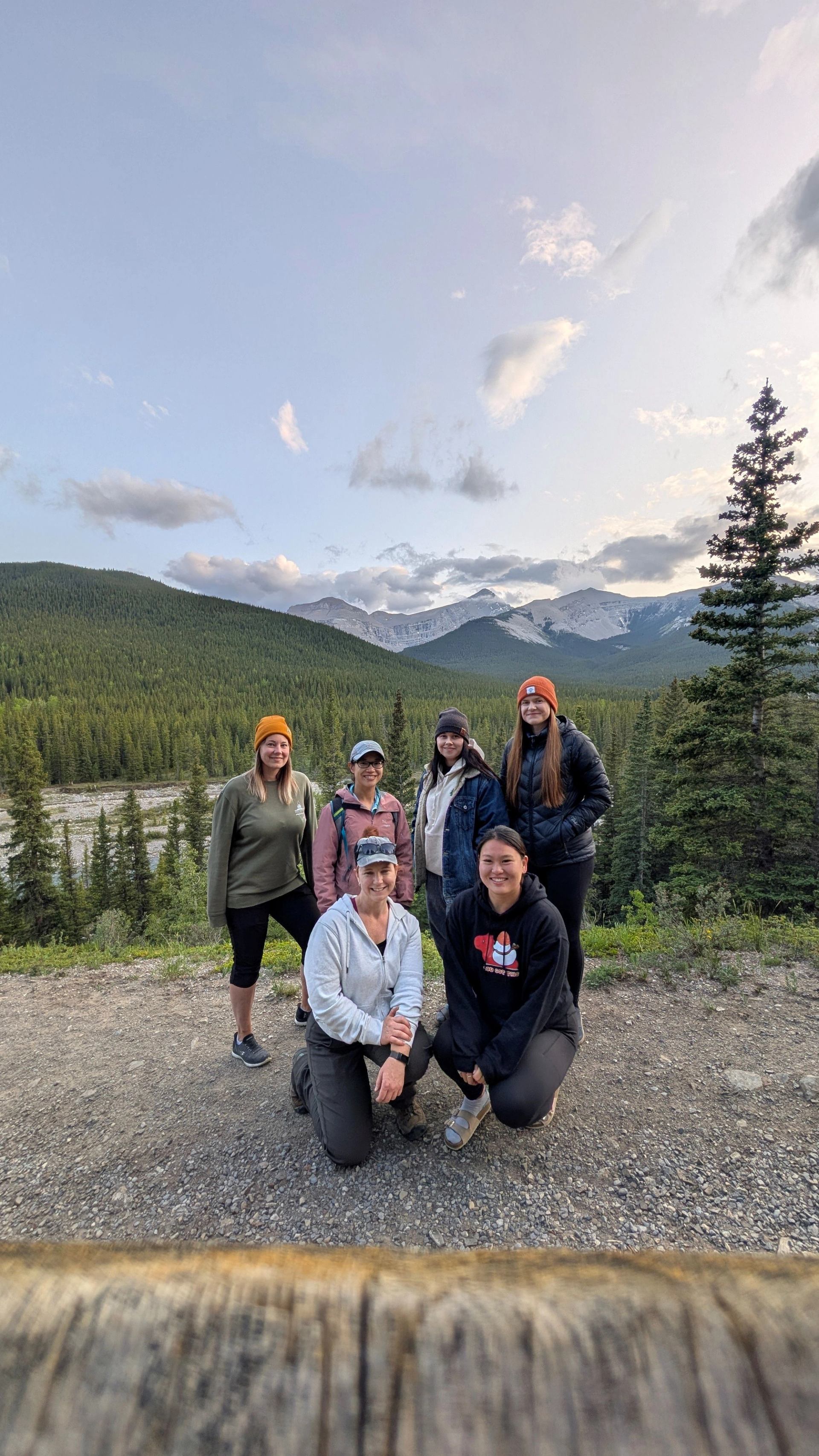 A group posing for a picture during their hiking excursion.