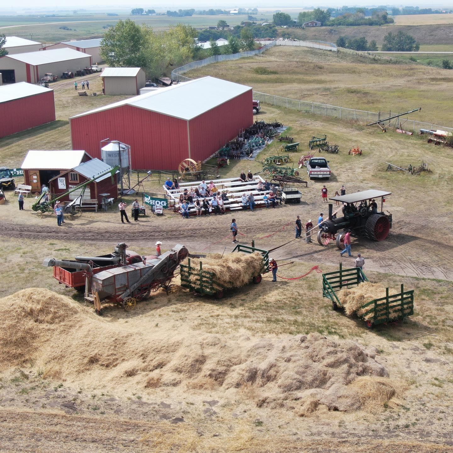 An Arial photo of an antique threshing demonstration with a steam tractor.