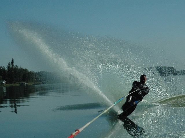 A person waterskiing on the lake