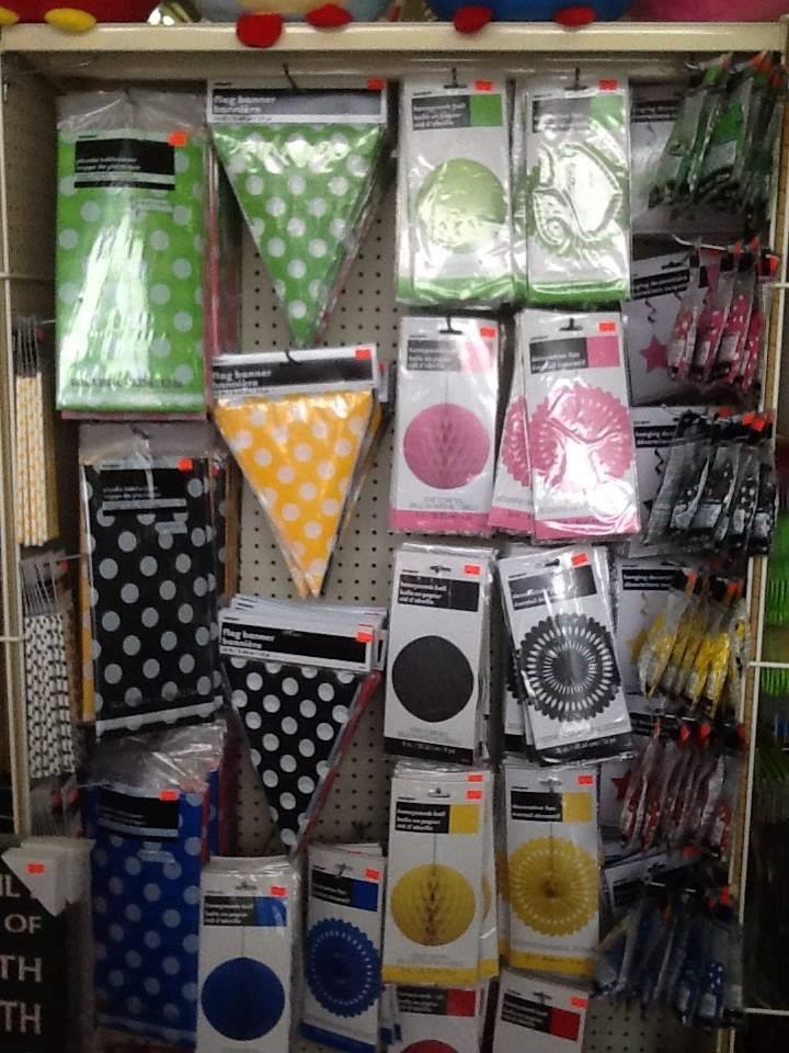 Artisan craft items on store shelves, including gift bags and decorative packages in rows.