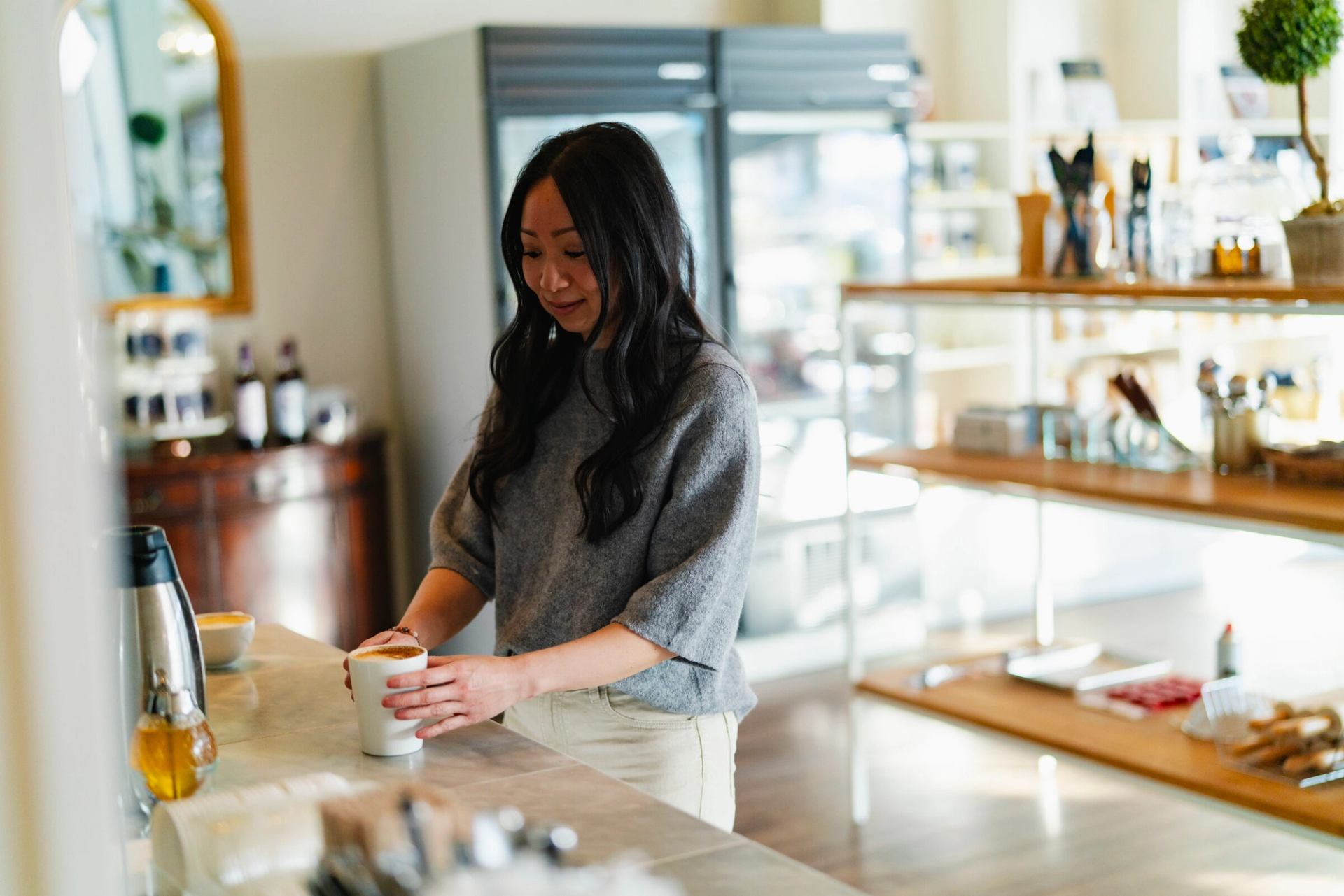 Server preparing a coffee.