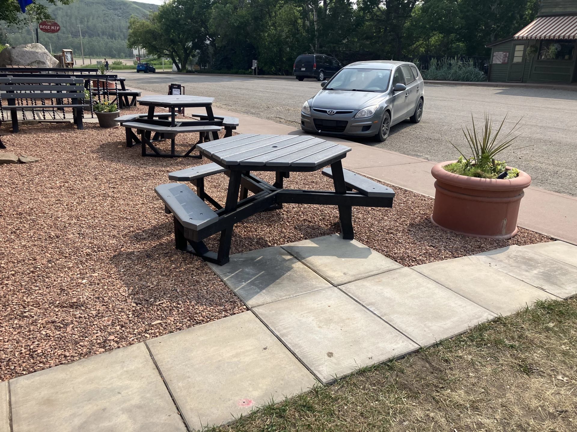 Patio facing south along main street with side walk access and planters