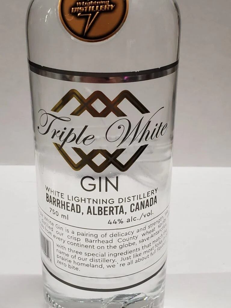 Triple White Gin bottle from White Lightning Distillery on a white background.