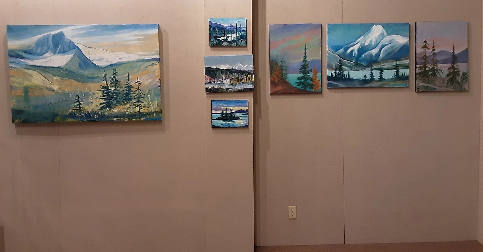 This is a photo of paintings in their art gallery.