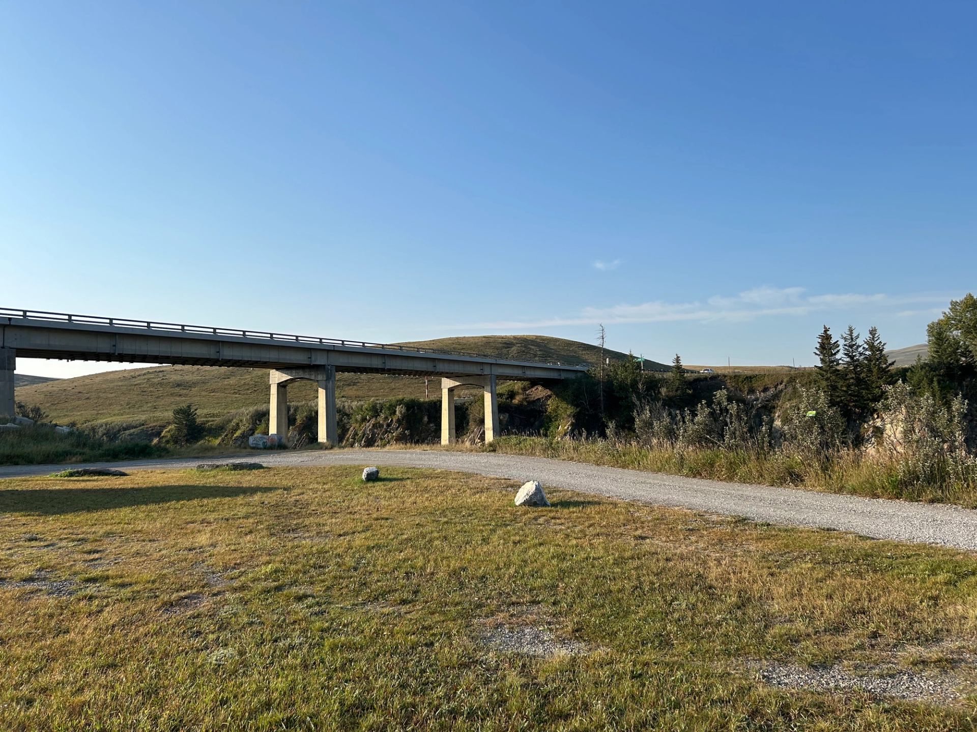 Road into Maycroft Provincial Recreation Area with Bridge in the background.
