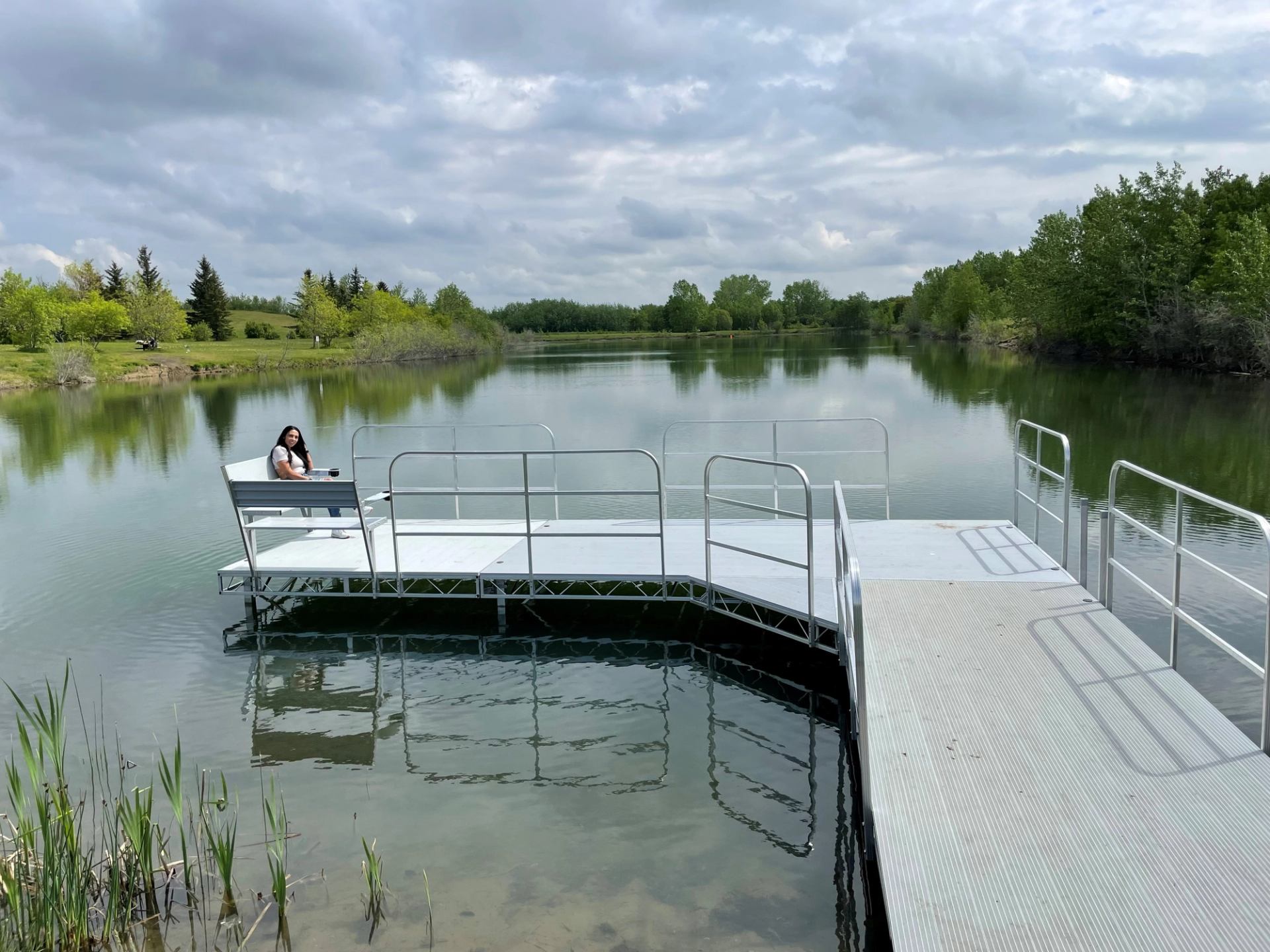 A person sitting on the dock