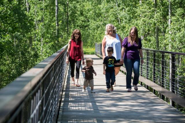 Family on a walk near Pigeon Lake.