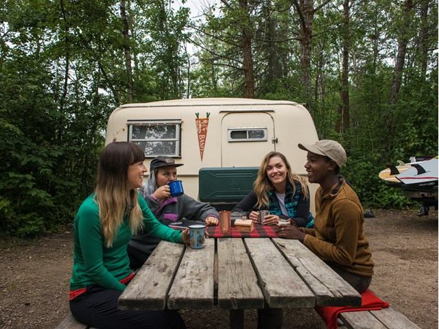Friends camping at Jarvis Bay Provincial Campground with a trailer.