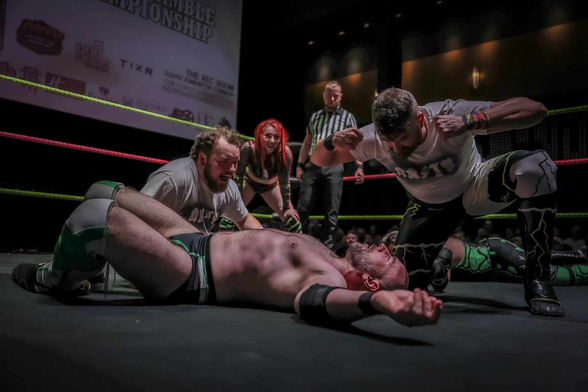 Two men wrestling.