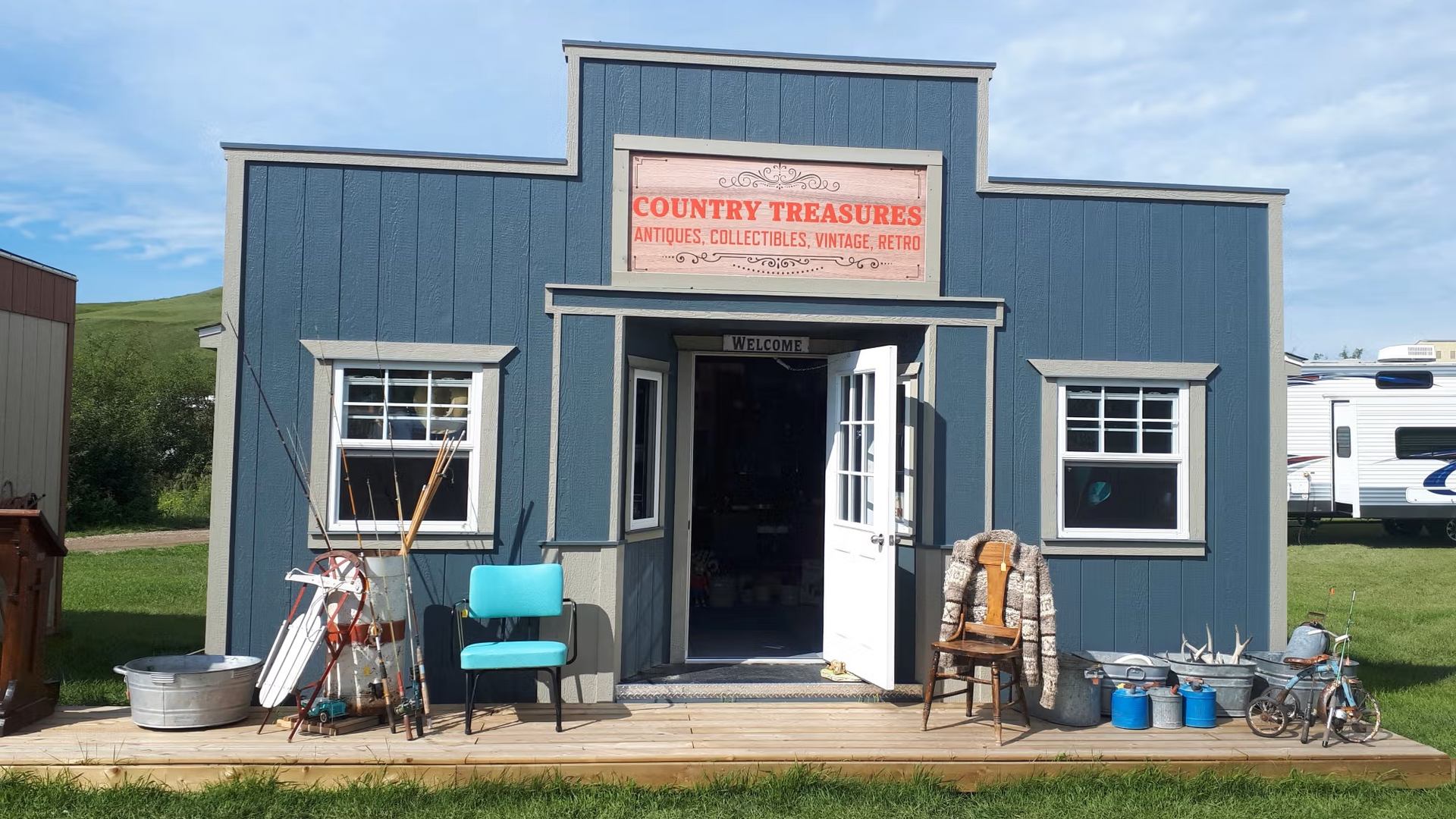 Country Treasures shop at High Eagle RV Park with antiques and outdoor decor.
