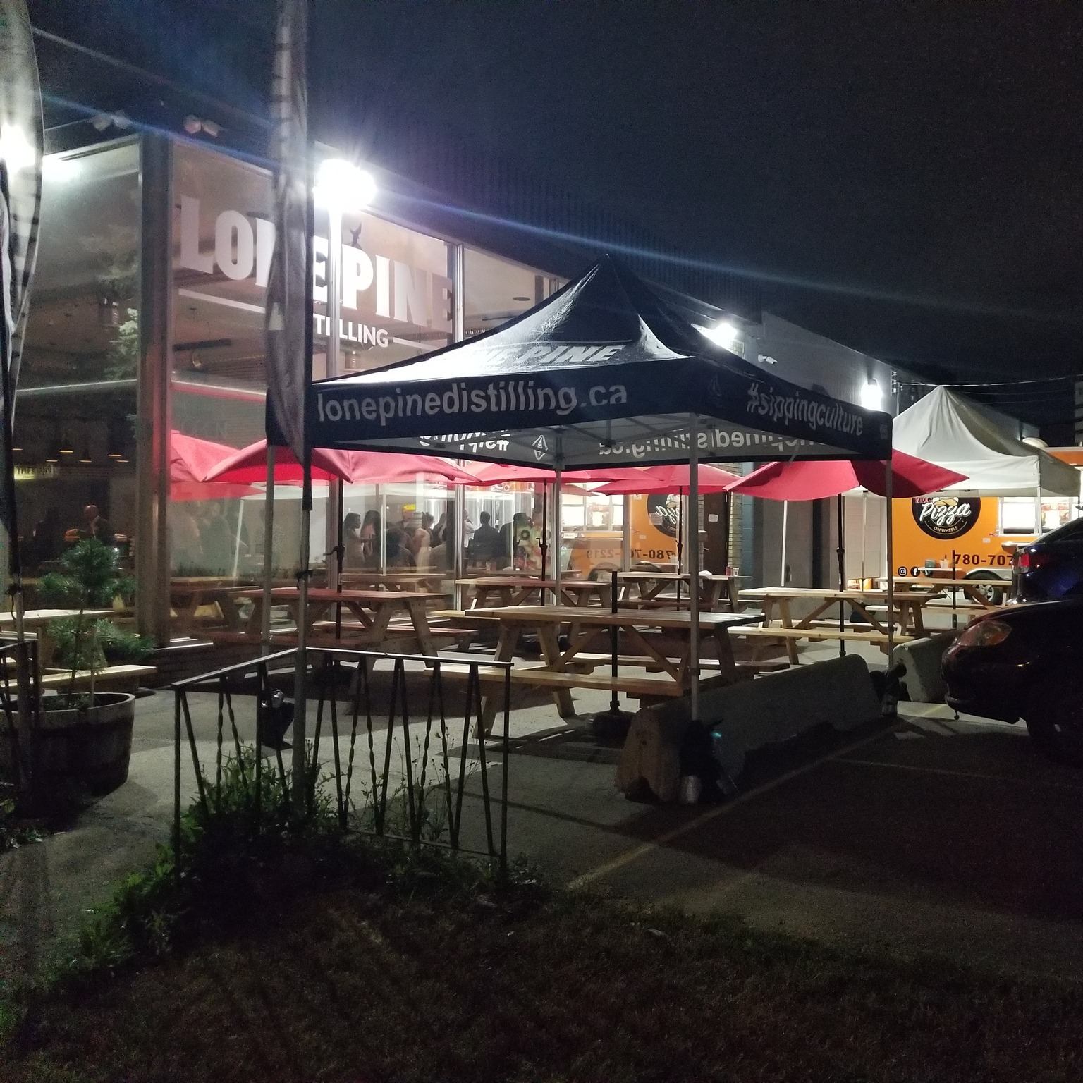 Patio has seating for 100 with picnic tables and umbrellas