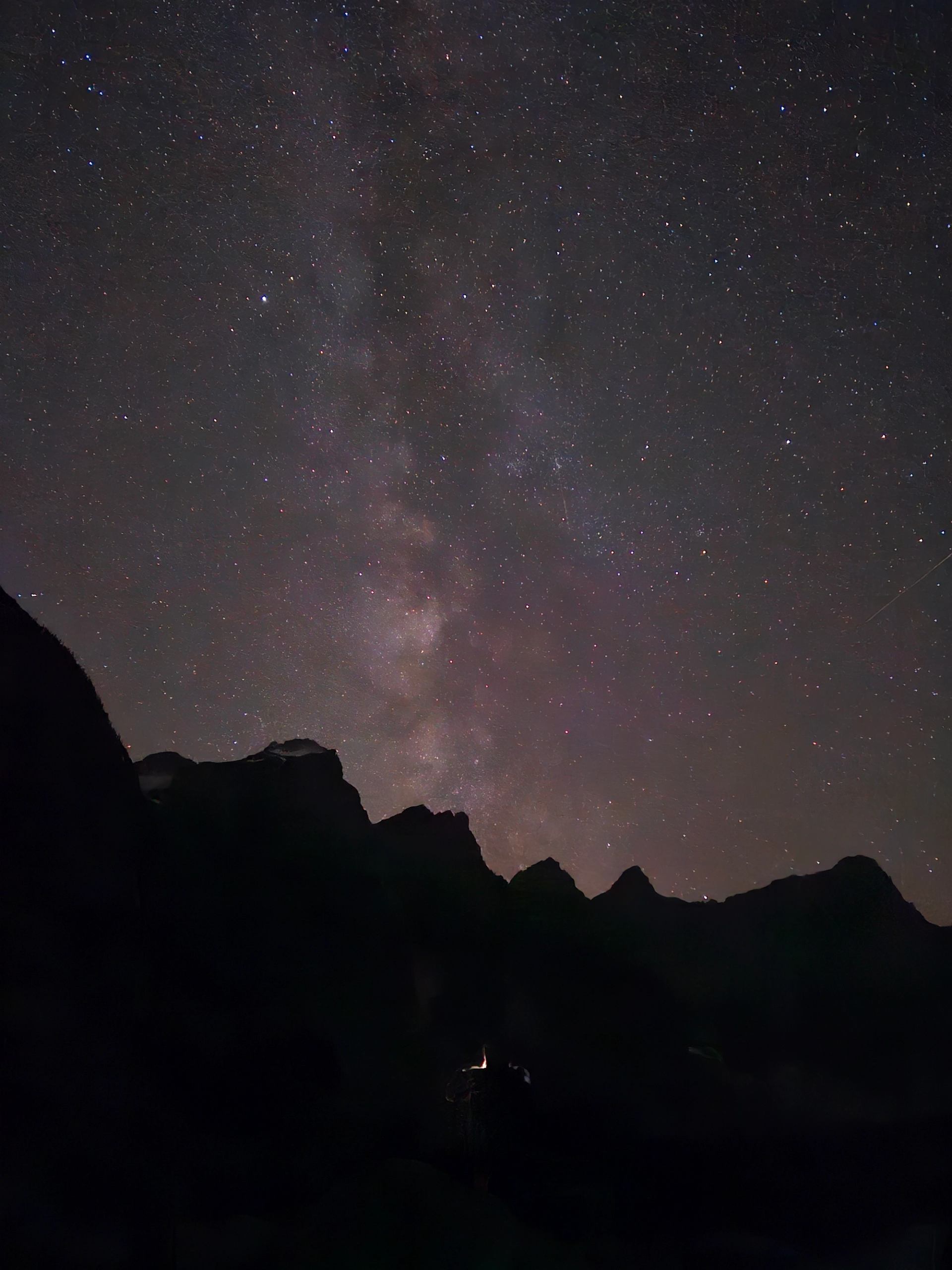 Star‑filled sky stretching above the Ten Peaks at Moraine Lake.